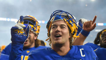 PITTSBURGH, PA - OCTOBER 23: Kenny Pickett #8 of the Pittsburgh Panthers celebrates after a 27-17 win over the Clemson Tigers at Heinz Field on October 23, 2021 in Pittsburgh, Pennsylvania. (Photo by Justin Berl/Getty Images)