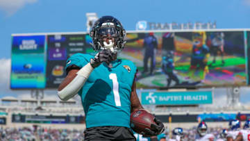 Travis Etienne Jr. #1 of the Jacksonville Jaguars scores a two-point conversion against the New York Giants at TIAA Bank Field on October 23, 2022 in Jacksonville, Florida. (Photo by Mike Carlson/Getty Images)
