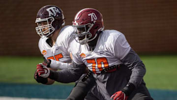 American offensive lineman Carson Green of Texas A&M (55) drills with American offensive lineman Alex Leatherwood of Alabama (70). Mandatory Credit: Vasha Hunt-USA TODAY Sports