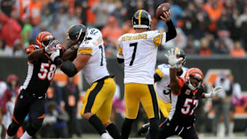 Pittsburgh Steelers quarterback Ben Roethlisberger (7) drops back to pass as Cincinnati Bengals linebacker Vincent Rey (57) and Cincinnati Bengals defensive end Carl Lawson (58) pressure in the second quarter during the Week 6 NFL game between the Pittsburgh Steelers and the Cincinnati Bengals, Sunday, Oct. 14, 2018, at Paul Brown Stadium in Cincinnati. It was tied 14-14 at the half.Pittsburgh Steelers Vs Cincinnati Bengals Oct 14
