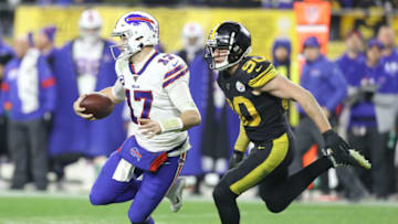 Dec 15, 2019; Pittsburgh, PA, USA; Buffalo Bills quarterback Josh Allen (17) scrambles away from Pittsburgh Steelers outside linebacker T.J. Watt (90) during the fourth quarter at Heinz Field. Buffalo won 17-10. Mandatory Credit: Charles LeClaire-USA TODAY Sports