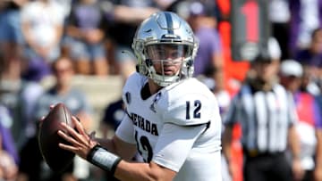Sep 18, 2021; Manhattan, Kansas, USA; Nevada Wolf Pack quarterback Carson Strong (12) drops back to pass during the first quarter against the Kansas State Wildcats at Bill Snyder Family Football Stadium. Mandatory Credit: Scott Sewell-USA TODAY Sports