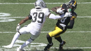 Las Vegas Raiders cornerback Nate Hobbs (39) defends Pittsburgh Steelers wide receiver Diontae Johnson (18). Mandatory Credit: Charles LeClaire-USA TODAY Sports