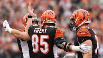 Nov 29, 2015; Cincinnati, OH, USA; Cincinnati Bengals tight end Tyler Eifert (85) reacts to scoring a touchdown with quarterback Andy Dalton (left) and offensive tackle Jake Fisher (right) in the first half against the St. Louis Rams at Paul Brown Stadium. Mandatory Credit: Aaron Doster-USA TODAY Sports
