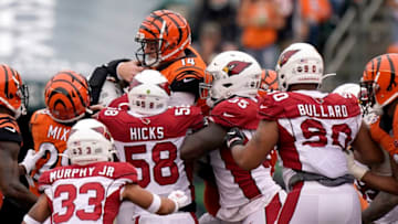 CINCINNATI, OHIO - OCTOBER 06: Andy Dalton #14 of the Cincinnati Bengals is stopped at the line of scrimmage for a loss during the NFL football game against the Arizona Cardinals at Paul Brown Stadium on October 06, 2019 in Cincinnati, Ohio. (Photo by Bryan Woolston/Getty Images)