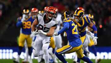LONDON, ENGLAND - OCTOBER 27: Tyler Eifert #85 of the Cincinnati Bengals is tackled by Marqui Christian #26 of the Los Angeles Rams during the NFL London Games series match between the Cincinnati Bengals and the Los Angeles Rams at Wembley Stadium on October 27, 2019 in London, England. (Photo by Justin Setterfield/Getty Images)