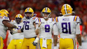 NEW ORLEANS, LOUISIANA - JANUARY 13: Joe Burrow #9 of the LSU Tigers reacts to a touchdown against Clemson Tigers during the third quarter in the College Football Playoff National Championship game at Mercedes Benz Superdome on January 13, 2020 in New Orleans, Louisiana. (Photo by Jonathan Bachman/Getty Images)
