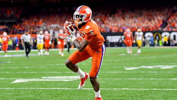 NEW ORLEANS, LOUISIANA - JANUARY 13: Tee Higgins #5 of the Clemson Tigers crosses the goal line during the fourth quarter of the College Football Playoff National Championship game against the LSU Tigers at the Mercedes Benz Superdome on January 13, 2020 in New Orleans, Louisiana. The LSU Tigers topped the Clemson Tigers, 42-25. (Photo by Alika Jenner/Getty Images)