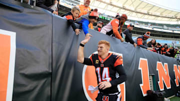 CINCINNATI, OH - OCTOBER 28: Andy Dalton #14 of the Cincinnati Bengals is congratulated by fans as he runs off of the field after defeating the Tampa Bay Buccaneers 37-34 at Paul Brown Stadium on October 28, 2018 in Cincinnati, Ohio. (Photo by Andy Lyons/Getty Images)