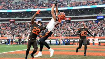 CLEVELAND, OH - DECEMBER 23: C.J. Uzomah #87 of the Cincinnati Bengals catches a touchdown pass in front of Jabrill Peppers #22 and Damarious Randall #23 of the Cleveland Browns during the fourth quarter at FirstEnergy Stadium on December 23, 2018 in Cleveland, Ohio. (Photo by Jason Miller/Getty Images)