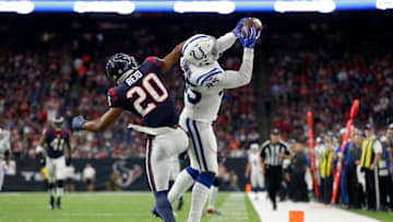 HOUSTON, TX - JANUARY 05: Eric Ebron #85 of the Indianapolis Colts catches a pass in the second quarter defended by Justin Reid #20 of the Houston Texans during the Wild Card Round at NRG Stadium on January 5, 2019 in Houston, Texas. (Photo by Tim Warner/Getty Images)