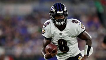 BALTIMORE, MARYLAND - AUGUST 15: Lamar Jackson #8 of the Baltimore Ravens runs with the ball in the first half of a preseason game against the Green Bay Packers at M&T Bank Stadium on August 15, 2019 in Baltimore, Maryland. (Photo by Todd Olszewski/Getty Images)
