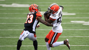 CINCINNATI, OHIO - OCTOBER 25: Jarvis Landry #80 of the Cleveland Browns carries the ball against Darius Phillips #23 of the Cincinnati Bengals during the first half at Paul Brown Stadium on October 25, 2020 in Cincinnati, Ohio. (Photo by Andy Lyons/Getty Images)
