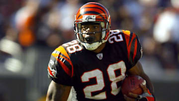 CINCINNATI, OH - OCTOBER 19: Corey Dillon #28 of the Cincinnati Bengals runs with the ball against the Baltimore Ravens during the 34-26 Bengals win over the Ravens October 19, 2003 at Paul Brown Stadium in Cincinnati, Ohio. (Photo by Andy Lyons/Getty Images)