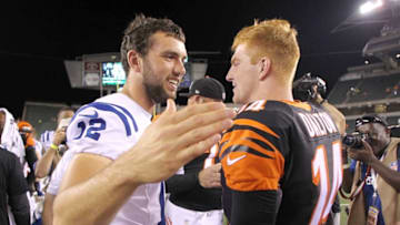 CINCINNATI, OH - AUGUST 28: Andrew Luck #12 of the Indianapolis Colts and Andy Dalton #14 of the Cincinnati Bengals talk after the game at Paul Brown Stadium on August 28, 2014 in Cincinnati, Ohio. Cincinnati defeated Indianapolis 35-7. (Photo by John Grieshop/Getty Images)