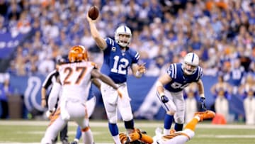INDIANAPOLIS, IN - JANUARY 04: Quarterback Andrew Luck #12 of the Indianapolis Colts throws against the Cincinnati Bengals in the second half during their AFC Wild Card game at Lucas Oil Stadium on January 4, 2015 in Indianapolis, Indiana. (Photo by Andy Lyons/Getty Images)