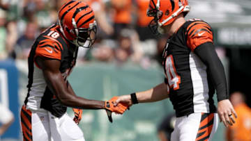 EAST RUTHERFORD, NJ - SEPTEMBER 11: Temmates Andy Dalton