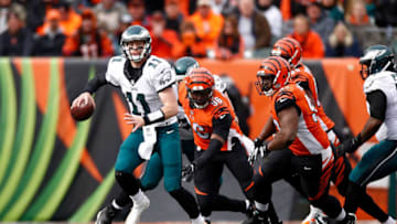 CINCINNATI, OH - DECEMBER 4: Carson Wentz #11 of the Philadelphia Eagles scrambles away from Geno Atkins #97 of the Cincinnati Bengals and Carlos Dunlap #96 of the Cincinnati Bengals during the first quarter at Paul Brown Stadium on December 4, 2016 in Cincinnati, Ohio. (Photo by Gregory Shamus/Getty Images)
