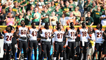 GREEN BAY, WI - SEPTEMBER 24: Members of the Cincinnati Bengals stand with arms locked as a sign of unity during the national anthem prior to their game against the Green Bay Packers at Lambeau Field on September 24, 2017 in Green Bay, Wisconsin. (Photo by Stacy Revere/Getty Images)