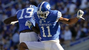 LEXINGTON, KY - SEPTEMBER 30: Tavin Richardson #11 of the Kentucky Wildcats and Kayaune Ross #19 of the Kentucky Wildcats celebrate a touchdown during the game against the Eastern Michigan Eagles at Commonwealth Stadium on September 30, 2017 in Lexington, Kentucky. (Photo by Michael Hickey/Getty Images)
