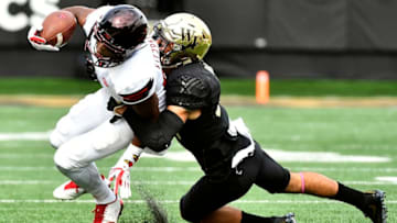 WINSTON SALEM, NC - OCTOBER 28: Defensive back Jessie Bates III #3 of the Wake Forest Demon Deacons tackles wide receiver Dez Fitzpatrick #87 of the Louisville Cardinals during the football game at BB&T Field on October 28, 2017 in Winston Salem, North Carolina. (Photo by Mike Comer/Getty Images)