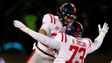 STARKVILLE, MS - NOVEMBER 23: D.K. Buford #25 of the Mississippi Rebels celebrates with Rod Taylor #73 after he scored a touchdown during the first half of an NCAA football game at Davis Wade Stadium on November 23, 2017 in Starkville, Mississippi. (Photo by Butch Dill/Getty Images)