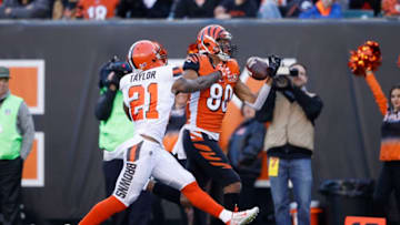 CINCINNATI, OH - NOVEMBER 26: Josh Malone #80 of the Cincinnati Bengals tries to make a one-handed catch against Jamar Taylor #21 of the Cleveland Browns in the second half of a game at Paul Brown Stadium on November 26, 2017 in Cincinnati, Ohio. The Bengals won 30-16. (Photo by Joe Robbins/Getty Images)