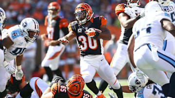 CINCINNATI, OH - SEPTEMBER 21: Michael Griffin #33 of the Tennessee Titans reaches up to grab the ankle of Cedric Peerman #30 of the Cincinnati Bengals during the fourth quarter at Paul Brown Stadium on September 21, 2014 in Cincinnati, Ohio. Cincinnati defeated Tennessee 33-7. (Photo by Andy Lyons/Getty Images)