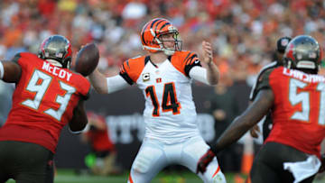 TAMPA, FL - NOVEMBER 30: Quarterback Andy Dalton #14 of the Cincinnati Bengals throws the ball under pressure against the Tampa Bay Buccaneers in the 2nd quarter at Raymond James Stadium on November 30, 2014 in Tampa, Florida. (Photo by Cliff McBride/Getty Images)