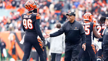 CINCINNATI, OH - JANUARY 1: Head Coach Marvin Lewis of the Cincinnati Bengals congratualtes Carlos Dunlap #96 of the Cincinnati Bengals after making a defensive stop during the third quarter of the game against the Baltimore Ravens at Paul Brown Stadium on January 1, 2017 in Cincinnati, Ohio. (Photo by Michael Hickey/Getty Images)