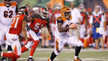 CINCINNATI, OH - AUGUST 11: Tra Carson #33 of the Cincinnati Bengals runs for a 16-yard gain against the Tampa Bay Buccaneers in the third quarter of a preseason game at Paul Brown Stadium on August 11, 2017 in Cincinnati, Ohio. (Photo by Joe Robbins/Getty Images)