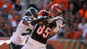 CINCINNATI, OH - OCTOBER 11: Tyler Eifert #85 of the Cincinnati Bengals catches a pass for his second touchdown of the game while being defended by Cary Williams #26 of the Seattle Seahawks during the fourth quarter at Paul Brown Stadium on October 11, 2015 in Cincinnati, Ohio. Cincinnati defeated Seattle 27-24 in overtime. (Photo by Andy Lyons/Getty Images)