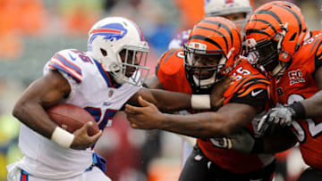 CINCINNATI, OH - OCTOBER 8: Vontaze Burfict #55 of the Cincinnati Bengals and Pat Sims #92 of the Cincinnati Bengals attempt to tackle LeSean McCoy #25 of the Buffalo Bills during the third quarter at Paul Brown Stadium on October 8, 2017 in Cincinnati, Ohio. (Photo by Michael Reaves/Getty Images)