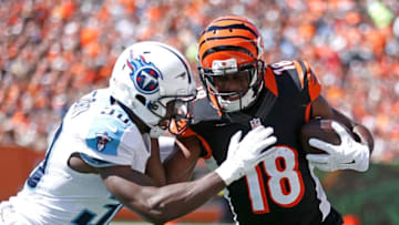 CINCINNATI, OH - SEPTEMBER 21: Jason McCourty #30 of the Tennessee Titans knocks A.J. Green #18 of the Cincinnati Bengals out of bounds during the first quarter at Paul Brown Stadium on September 21, 2014 in Cincinnati, Ohio. (Photo by Joe Robbins/Getty Images)