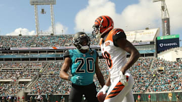 JACKSONVILLE, FL - NOVEMBER 05: A.J. Green #18 of the Cincinnati Bengals and Jalen Ramsey #20 of the Jacksonville Jaguars discuss a play in the first half of their game at EverBank Field on November 5, 2017 in Jacksonville, Florida. (Photo by Logan Bowles/Getty Images)