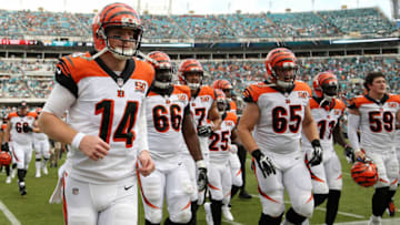 JACKSONVILLE, FL - NOVEMBER 05: Andy Dalton #14 of the Cincinnati Bengals leaves the field with his teammates at halftime of their game against the Jacksonville Jaguars at EverBank Field on November 5, 2017 in Jacksonville, Florida. (Photo by Logan Bowles/Getty Images)