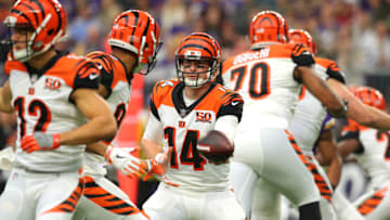 MINNEAPOLIS, MN - DECEMBER 17: Andy Dalton #14 of the Cincinnati Bengals hands the ball off to Josh Malone in the first quarter of the game against the Minnesota Vikings on December 17, 2017 at U.S. Bank Stadium in Minneapolis, Minnesota. (Photo by Adam Bettcher/Getty Images)