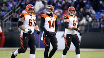BALTIMORE, MD - DECEMBER 31: Quarterback Andy Dalton #14 of the Cincinnati Bengals walks off the field with guard Christian Westerman #63 and center Russell Bodine #61 against the Baltimore Ravens at M&T Bank Stadium on December 31, 2017 in Baltimore, Maryland. (Photo by Rob Carr/Getty Images)
