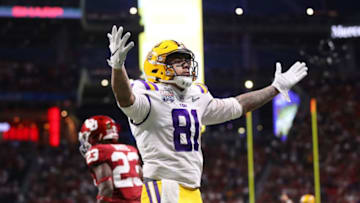 ATLANTA, GEORGIA - DECEMBER 28: Tight end Thaddeus Moss #81 of the LSU Tigers celebrates a touchdown in the second quarter over the Oklahoma Sooners during the Chick-fil-A Peach Bowl at Mercedes-Benz Stadium on December 28, 2019 in Atlanta, Georgia. (Photo by Gregory Shamus/Getty Images)