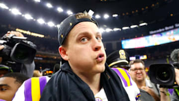 NEW ORLEANS, LOUISIANA - JANUARY 13: Joe Burrow #9 of the LSU Tigers celebrates after defeating the Clemson Tigers 42-25 in the College Football Playoff National Championship game at Mercedes Benz Superdome on January 13, 2020 in New Orleans, Louisiana. (Photo by Kevin C. Cox/Getty Images)
