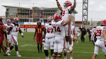 AMES, IA - SEPTEMBER 12: Running back Trey Ragas #9 of the Louisiana-Lafayette Ragin Cajuns is lifted into the air by teammate offensive lineman Max Mitchell #74 of the Louisiana-Lafayette Ragin Cajuns after he scored a touchdown in the second half of the play against the Iowa State Cyclones at Jack Trice Stadium on September 12, 2020 in Ames, Iowa. The Louisiana-Lafayette Ragin Cajuns won 31-14 over the Iowa State Cyclones. (Photo by David K Purdy/Getty Images)