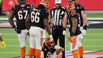 INGLEWOOD, CALIFORNIA - FEBRUARY 13: Joe Burrow #9 of the Cincinnati Bengals holds his knee following a play during the second half of Super Bowl LVI against the Los Angeles Rams at SoFi Stadium on February 13, 2022 in Inglewood, California. (Photo by Andy Lyons/Getty Images)