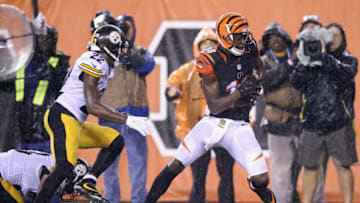 CINCINNATI, OH - JANUARY 09: A.J. Green #18 of the Cincinnati Bengals makes a reception for a touchdown in the fourth quarter against the Pittsburgh Steelers during the AFC Wild Card Playoff game at Paul Brown Stadium on January 9, 2016 in Cincinnati, Ohio. (Photo by Andy Lyons/Getty Images)