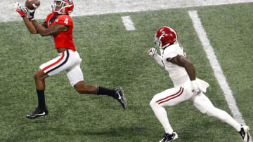 ATLANTA, GA - JANUARY 08: Wide receiver Mecole Hardman #4 catches a pass for a touchdown behind safety Tony Brown #2 of the Alabama Crimson Tide during the College Football Playoff National Championship game at Mercedes-Benz Stadium on January 8, 2018 in Atlanta, Georgia. (Photo by Mike Zarrilli/Getty Images)