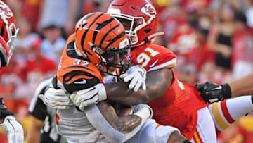 KANSAS CITY, MO - AUGUST 10: Derrick Nnadi #91 of the Kansas City Chiefs tackles Trayveon Williams #32 of the Cincinnati Bengals in the first quarter during a preseason game at Arrowhead Stadium on August 10, 2019 in Kansas City, Missouri. (Photo by Peter Aiken/Getty Images)