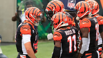 CINCINNATI, OHIO - SEPTEMBER 13: Joe Burrow #9 of the Cincinnati Bengals celebrates with teammates after running for his first NFL touchdown against the Los Angeles Chargers during the game at Paul Brown Stadium on September 13, 2020 in Cincinnati, Ohio. (Photo by Andy Lyons/Getty Images)