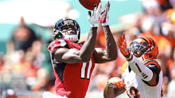 CINCINNATI, OH - SEPTEMBER 14: Julio Jones #11 of the Atlanta Falcons and George Iloka #43 of the Cincinnati Bengals both attempt to catch a pass during the second quarter at Paul Brown Stadium on September 14, 2014 in Cincinnati, Ohio. The play resulted in an incomplete pass. (Photo by Andy Lyons/Getty Images)