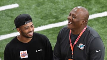 Former Clemson defensive end coach Marion Hobby, with the Miami Dolphins, talks with Darien Rencher during Clemson pro day at the Poe Indoor Facility in Clemson Thursday, March 14, 2019.Clemson Pro Day