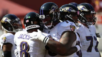 Oct 4, 2020; Landover, Maryland, USA; Baltimore Ravens quarterback Lamar Jackson (8) hugs Ravens offensive tackle Orlando Brown (78) during warmups prior to the Ravens'game against the Washington Football Team at FedExField. Mandatory Credit: Geoff Burke-USA TODAY Sports