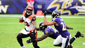 Oct 11, 2020; Baltimore, Maryland, USA; Cincinnati Bengals running back Joe Mixon (28) gets tackled by Baltimore Ravens linebacker Jaylon Ferguson (45) in the second quarter at M&T Bank Stadium. Mandatory Credit: Evan Habeeb-USA TODAY Sports